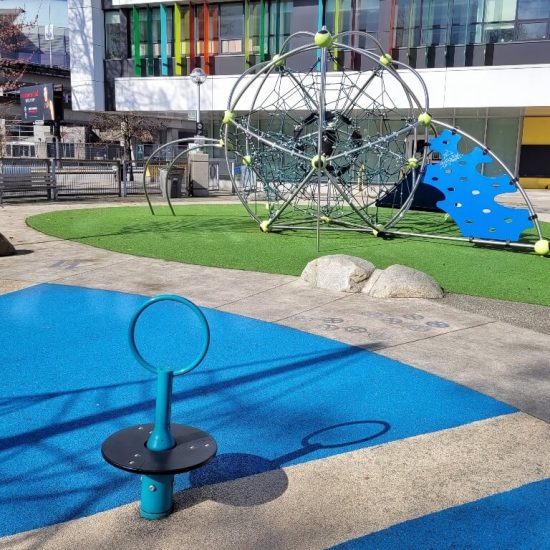 Spinner and net dome at Crosstown elementary playground