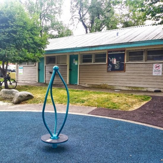 Fieldhouse and spinning pole at Pandora Park playground