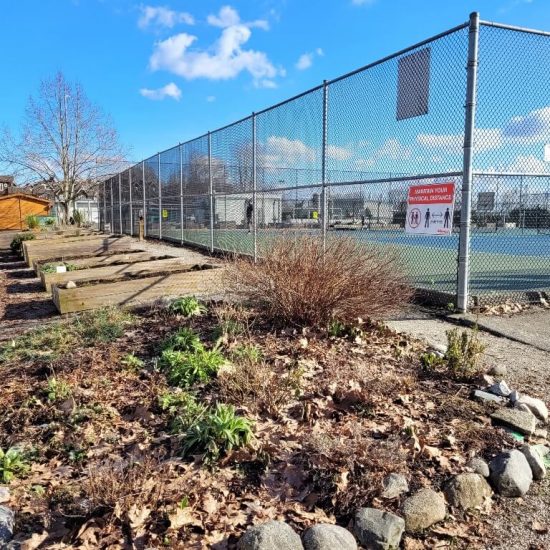 Community garden and tennis courts at Riverfront Park playground