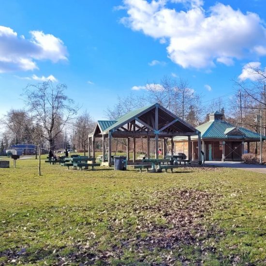 Fieldhouse and picnic area at Riverfront Park playground